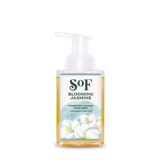 A clear pump bottle of Blooming Jasmine Hydrating Foaming Hand Wash with yellow liquid, a floral design, and a front label highlighting agave, aloe vera, and its paraben-free, SLS-free formula.