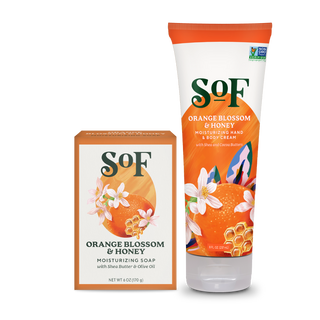A box of Orange Blossom and Honey Bar Soap and Hand & Body Cream, both with floral and orange designs, ideal for daily cleansing with shea butter, olive oil, and beautifully layered scents.