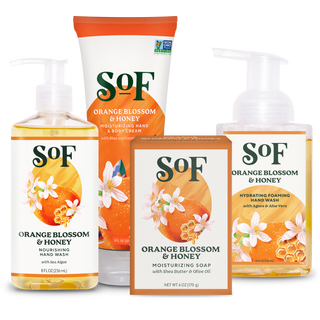 The Orange Blossom & Honey Bundle includes hand wash, body cream, foaming hand wash, and moisturizing soap with orange blossom and honey designs on white and orange packaging.
